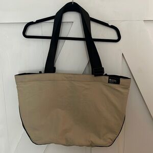 LuLuLemon Bag NWT tan with black trim excellent condition